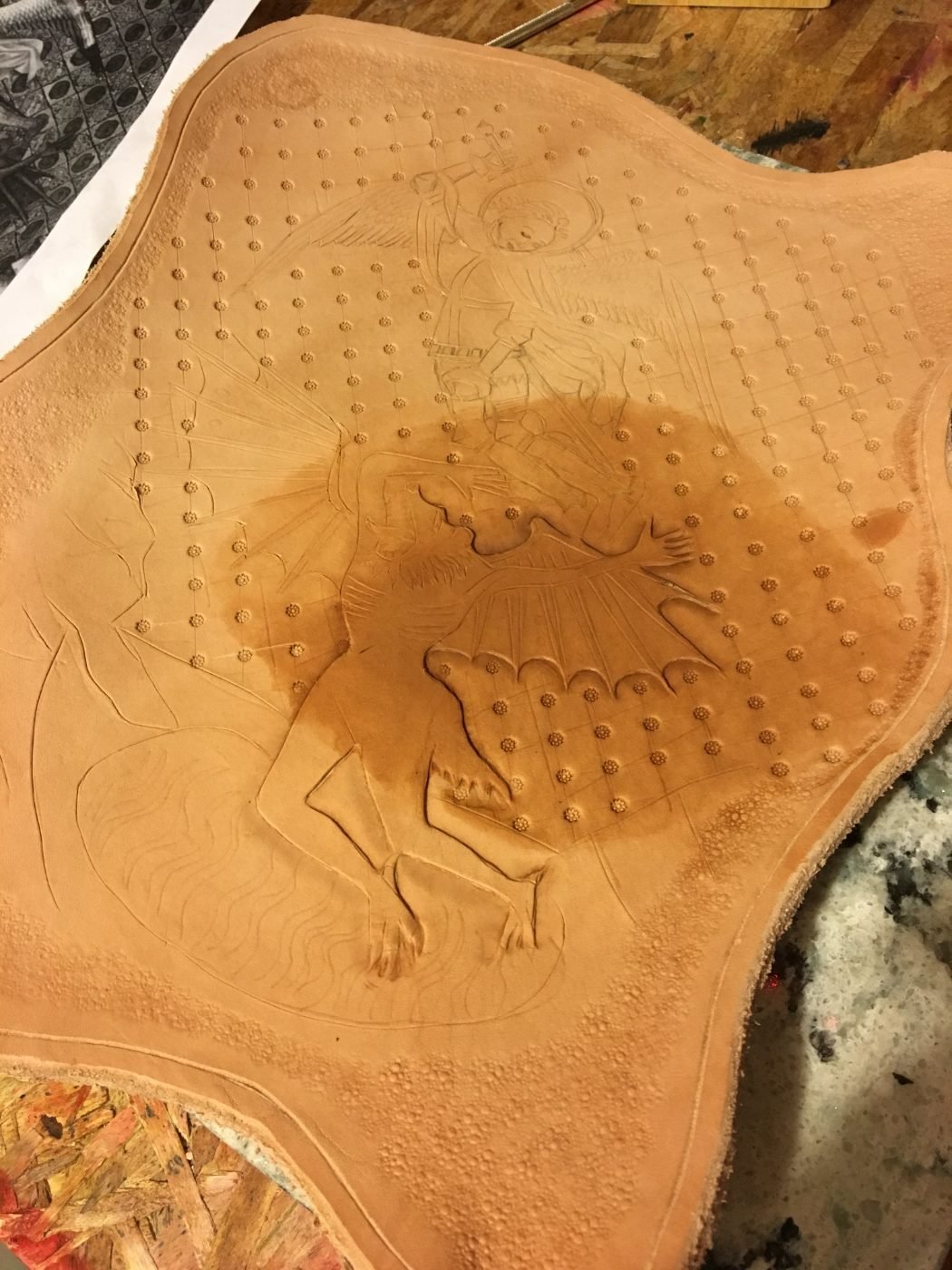 Featured tooled leather piece — St. Michael & the dragon