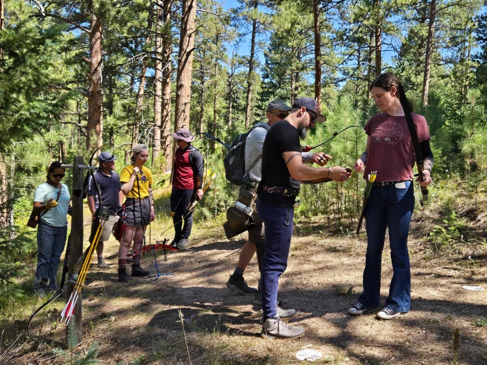 Group archery lesson in the pines