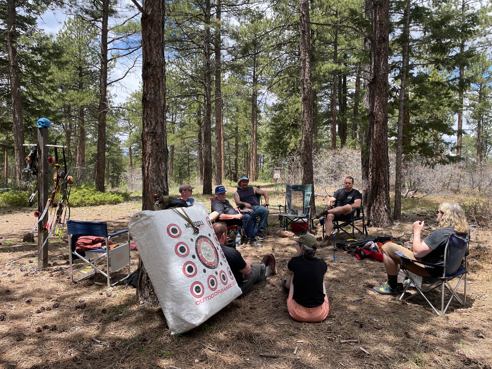 Circle of archers gathered in the pines