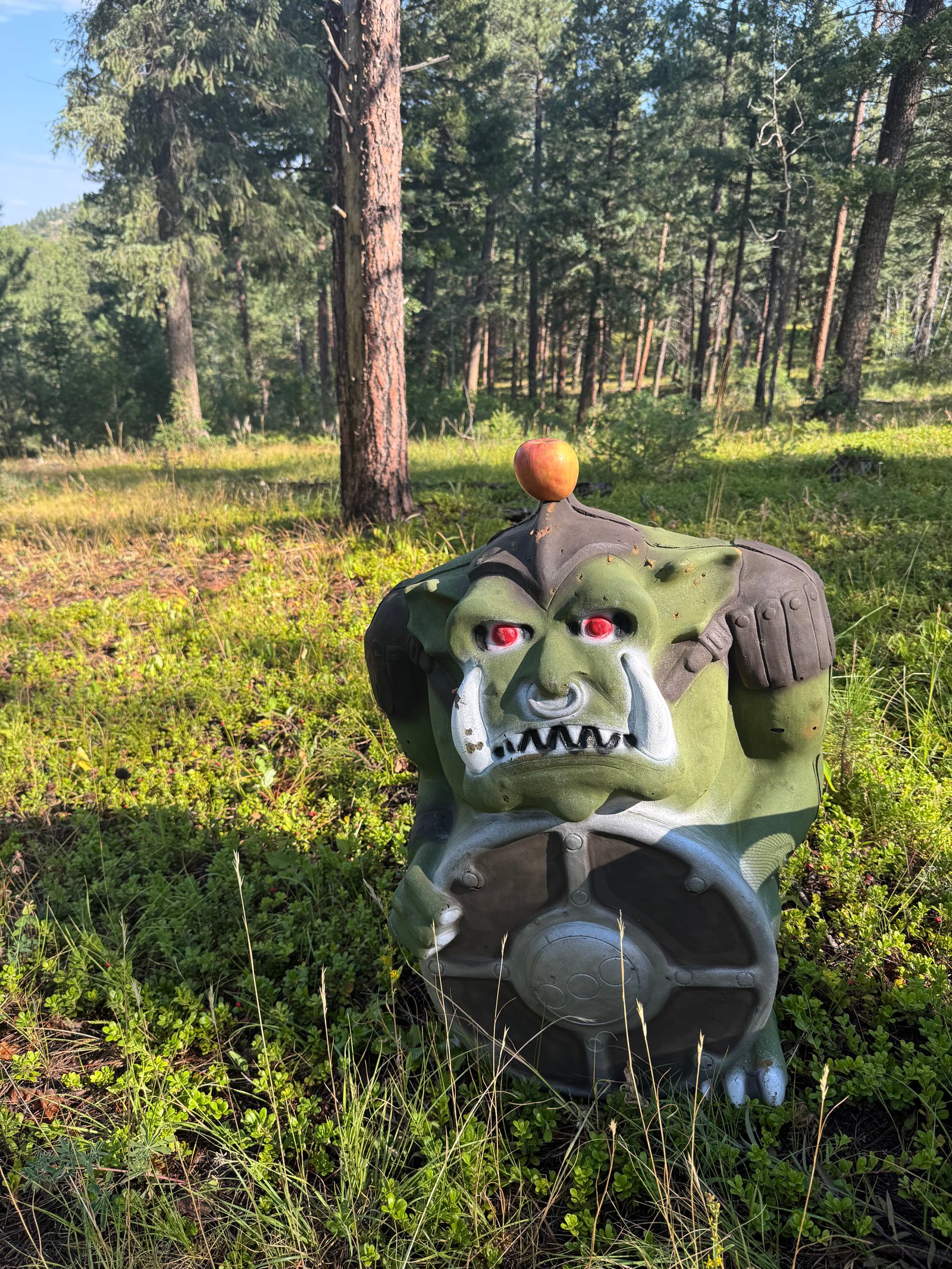 Orc 3D target with an apple balanced on its head